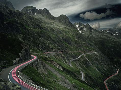 Trail of car tail light through mountain pass road, Switzerland | HD ...