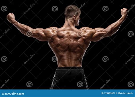 Muscular Man Showing Back Muscles, Isolated on Black Background. Strong ...