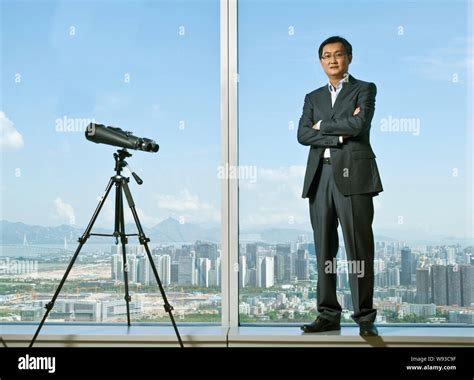 --FILE--Pony Ma Huateng, Chairman of Tencent, poses for photos at the headquarter building of ...