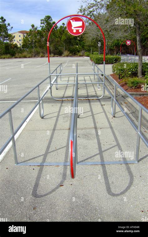 Shopping cart storage area in a shopping mall parking lot Stock Photo ...