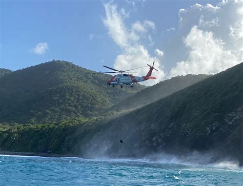 Coast Guard MH-60T rescue man from the Annaly Bay tide pools