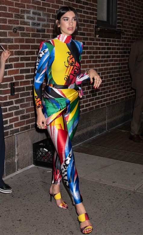 dua lipa stands out in a colorful outfit as she leaves 'the late show with stephen colbert' in ...