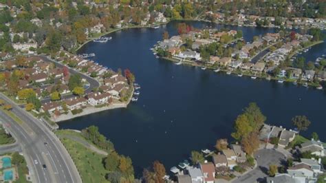 4K stock footage aerial video of flying over homes surrounding Westlake Lake, Westlake Village ...