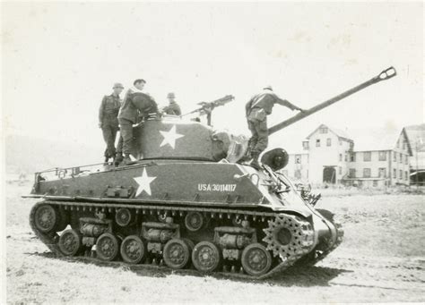 Four American soldiers on top of a tank, 1944 | The Digital Collections of the National WWII ...