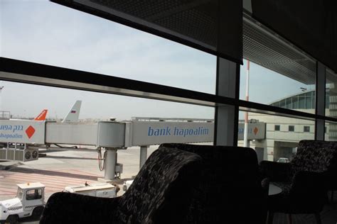 an airport terminal looking out the window at planes on the tarmac and ...