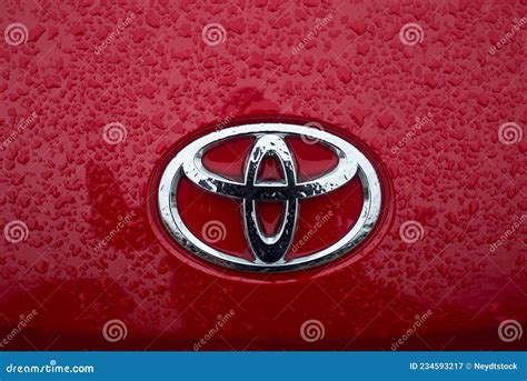 Rain Drops on Toyota Logo on Red Car Front Editorial Photography ...