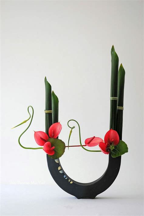 Ikebana Flower Arrangement in Stylish Ceramic Vase