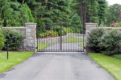 Iron driveway gate for a small driveway with a simple scroll detail in ...