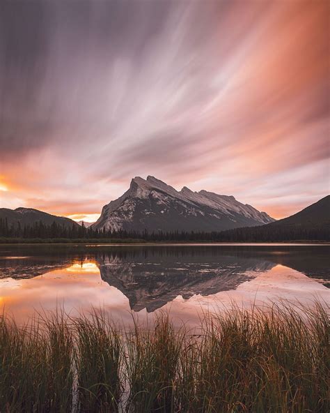 A cloudy sunrise in the Canadian Rockies. [OC] [1080x1350] : r/EarthPorn