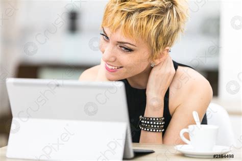 Woman smiling to a computer screen - stock photo 2194498 | Crushpixel