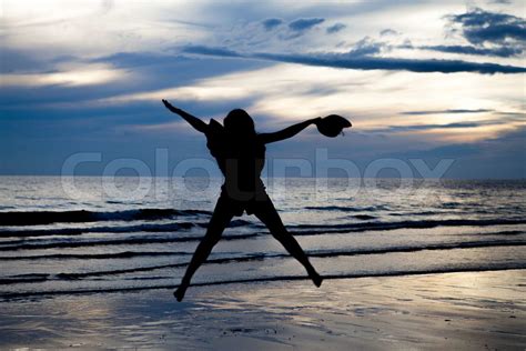 Silhouette girl on beach | Stock image | Colourbox