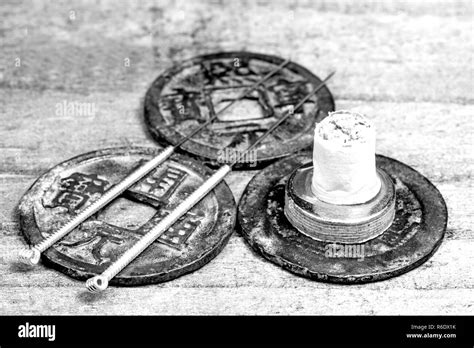 Acupuncture needles antique chinese coin Black and White Stock Photos & Images - Alamy