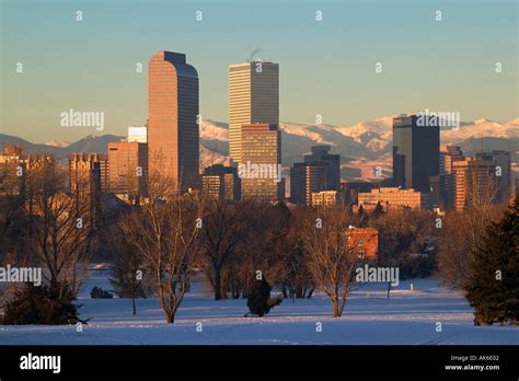 Denver Colorado skyline at sunrise with Rocky Mountains in distance ...