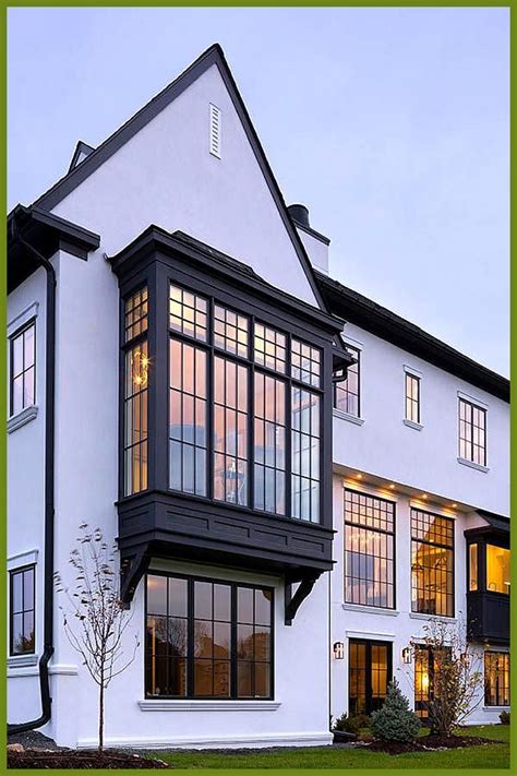 Modern Tudor Home with Black Windows This Midwestern home pays tribute to the Tudor style w… in ...