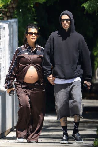 Pregnant Kourtney Kardashian Shows Off Her Bare Bump on Sunny Stroll with Husband Travis Barker