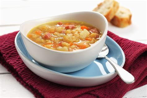 Bowl of soup with diced onion, carrots, potato and split peas | Split ...