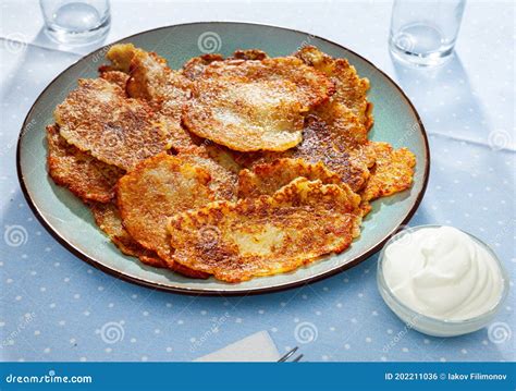 Belarusian Potato Pancakes Draniki with Sour Cream at Plate Stock Photo ...