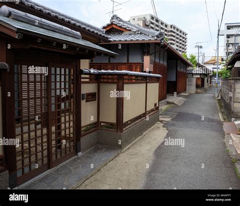 Narrow Japanese road with traditional wooden houses Stock Photo - Alamy