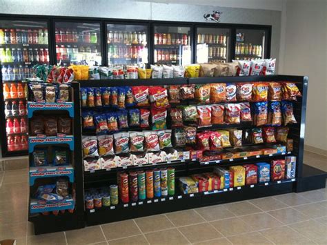 a grocery store filled with lots of different types of food and drinks on display in front of ...