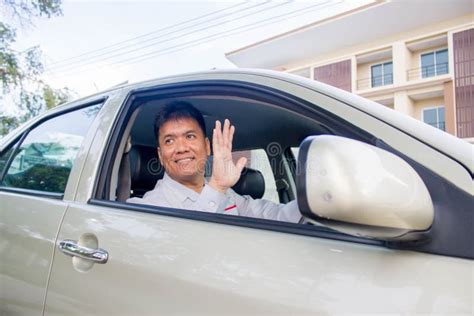 Businessman Waves Hand As a Sign of Greeting. Stock Photo - Image of businessman, adult: 70224124