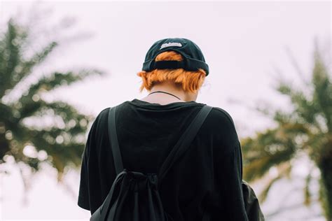 Person in Black Top Wearing Backpack Outdoors · Free Stock Photo