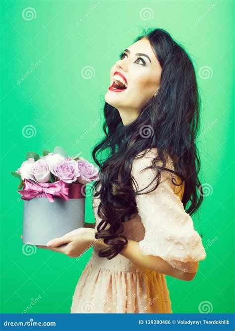 Girl with roses on green stock photo. Image of face - 139280486