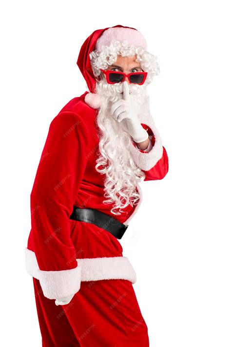 Premium Photo | Santa claus in red suit with beard in glasses holds ...