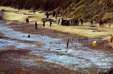 Reportage photo of SS Torrey Canyon Disaster, 1967. Clean up operation ...