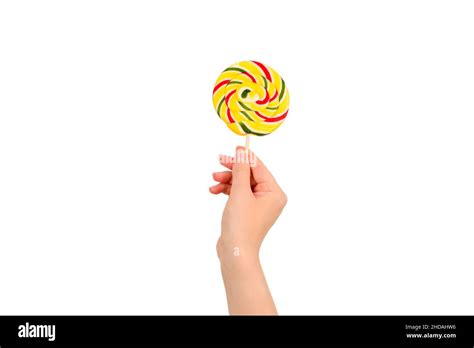 Lollipop in female hand isolated on white background. Space for text or design Stock Photo - Alamy