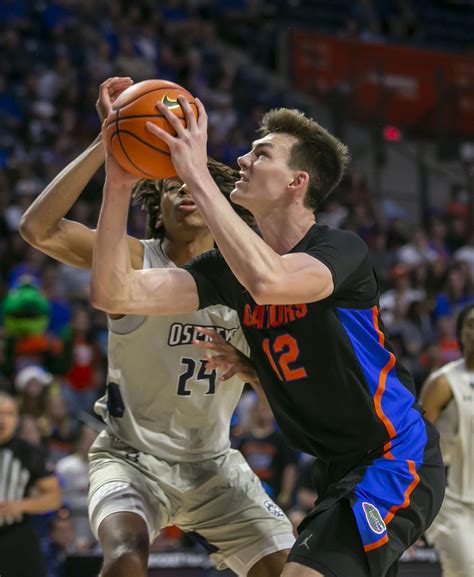 No. 20 Florida bounces back from stunner, handles UNF 85-55 | AP News