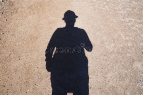 Shadow of a Man on the Ground in an Engineering Hat Stock Image - Image ...