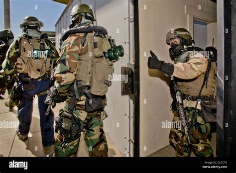 FBI SWAT (Special Weapons and Tactics) team member wears specialized "weapons of Mass ...