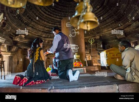 Religious rituals being performed inside a Hindu Temple in Khajuraho ...