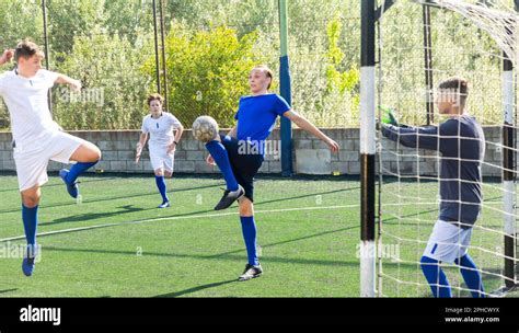 Teens playing soccer football match. Competition between two youth ...