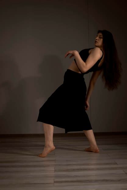 Premium Photo | Slender flexible dance performer during a dance practice in modern studio