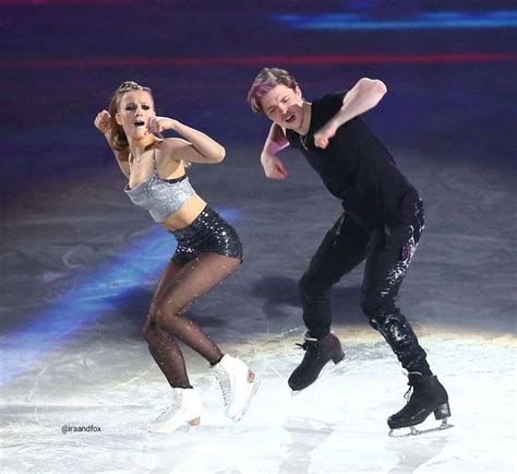 two people are performing on the ice