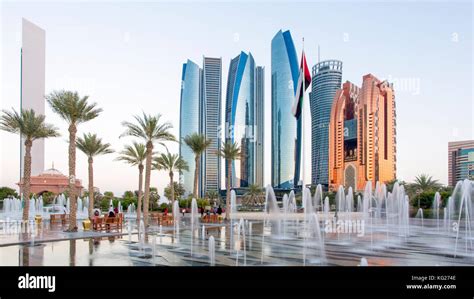 Etihad Towers viewed over the fountains of the Emirates Palace Hotel, Abu Dhabi, United Arab ...