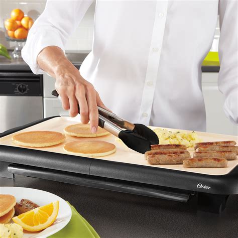 Oster® Titanium Infused DuraCeramic™ 10" x 18-1/2" Griddle w/ Warming Tray - CKSTGRFM18WT-033 ...