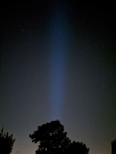 Weird beam of light in the night sky over my home city. Cork, Ireland. In the picture it looks ...