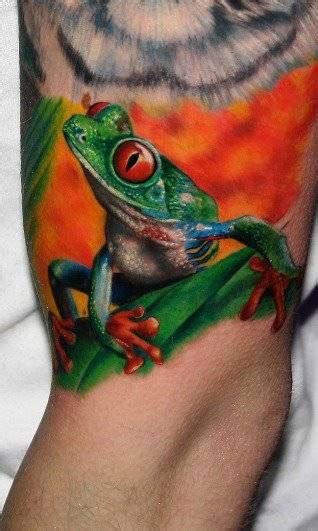 Realistic style tattoo of a frog.