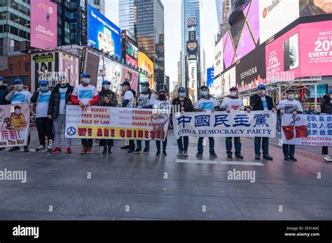 Pro Chinese democracy activists hold banners during the China Democracy ...