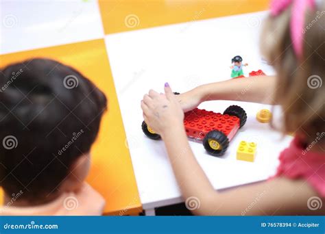 Kids playing with lego stock photo. Image of concentrated - 76578394