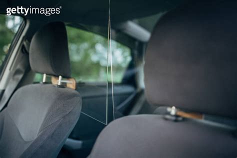 Interior of a taxi car with plastic divider between front and back ...