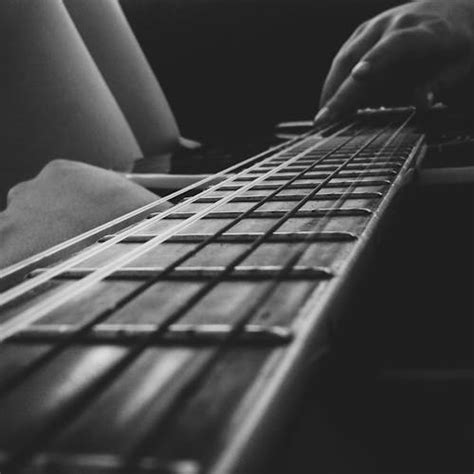 Grayscale Photography of Person Playing Yamaha Acoustic Guitar · Free Stock Photo