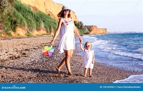 Family on the Beach at Sunset. Stock Image - Image of lifestyle ...