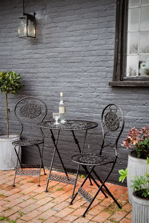 Lifestyle image of the Black Metal Garden Table & Chairs Set Round Garden Table, Garden Chairs ...