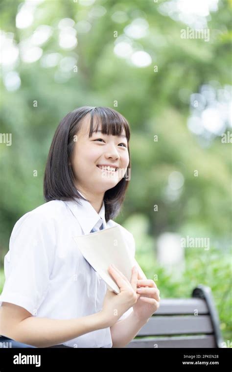 High school girls reading Stock Photo - Alamy