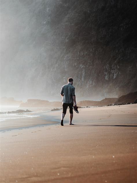 Man Walking on Beach · Free Stock Photo