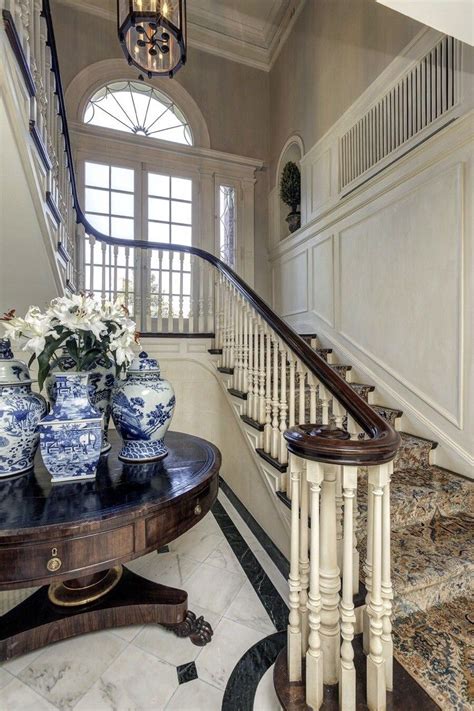 Georgian Mansion Foyer with Curved Staircase