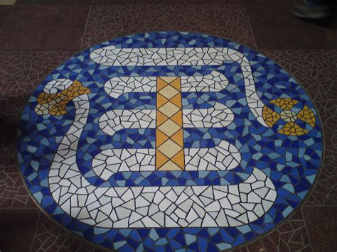 a blue and white mosaic design on the ground